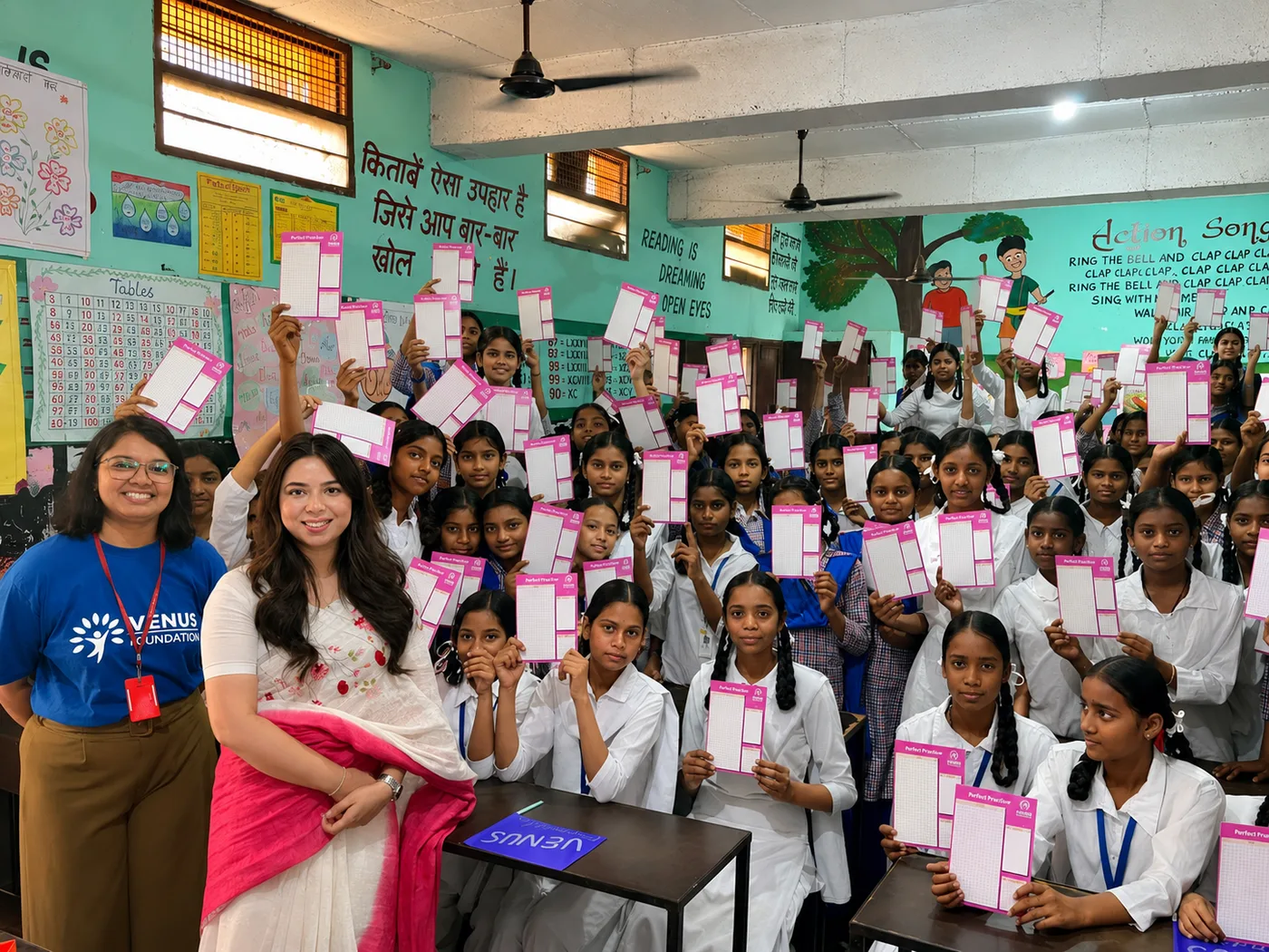 Girls taking part in a HerHealth session with period tracker cards