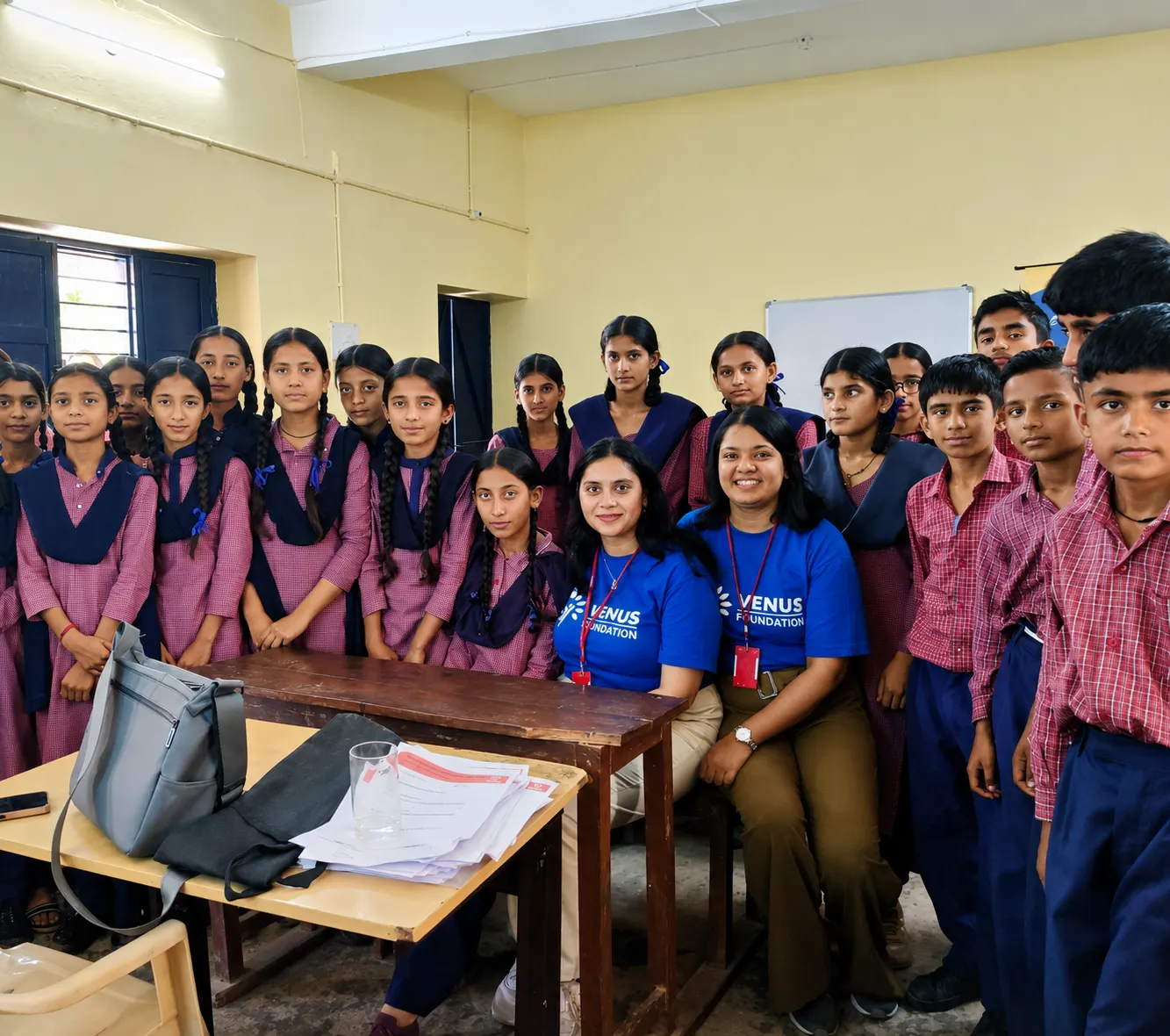 Venus Foundation team with a group of students at a school