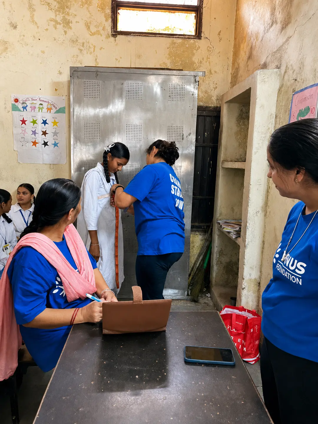 The Nayi Shuruaat team taking measurements during a skills session