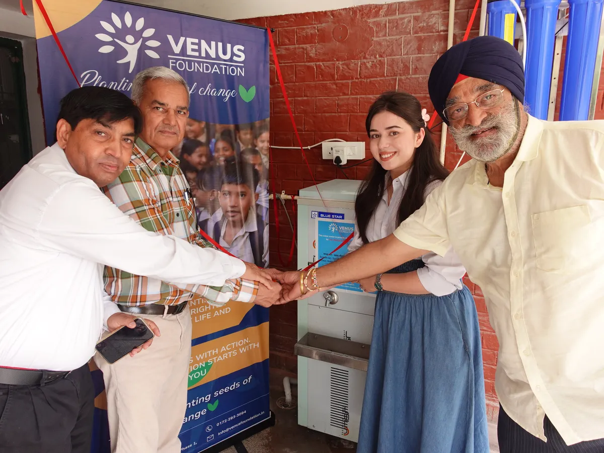 Installing a clean water cooler at a school