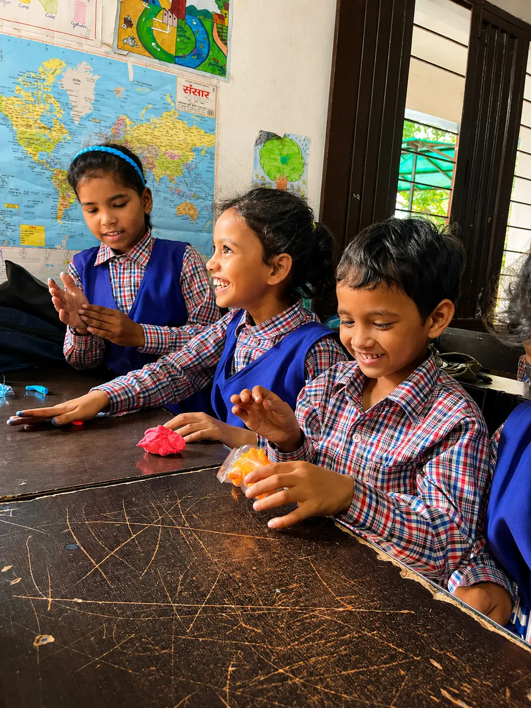 Children playing and learning in a revived Anganwadi